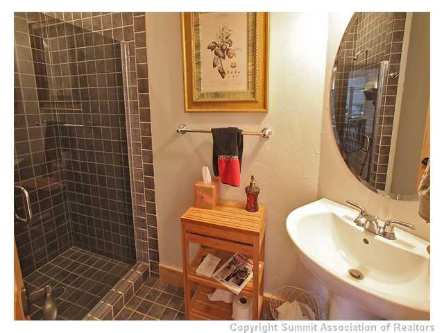 6 Rounds Road Breckenridge, CO 80424 - Photo 24 of 25 a bathroom with a sink mirror and shower