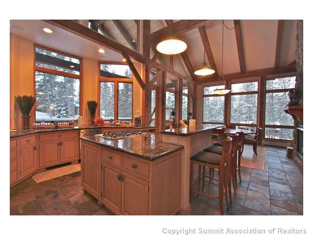 6 Rounds Road Breckenridge, CO 80424 - Photo 4 of 25 a kitchen with a sink and wooden cabinets