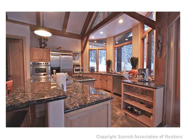 6 Rounds Road Breckenridge, CO 80424 - Photo 5 of 25 a kitchen with stainless steel appliances granite countertop a stove refrigerator and cabinets