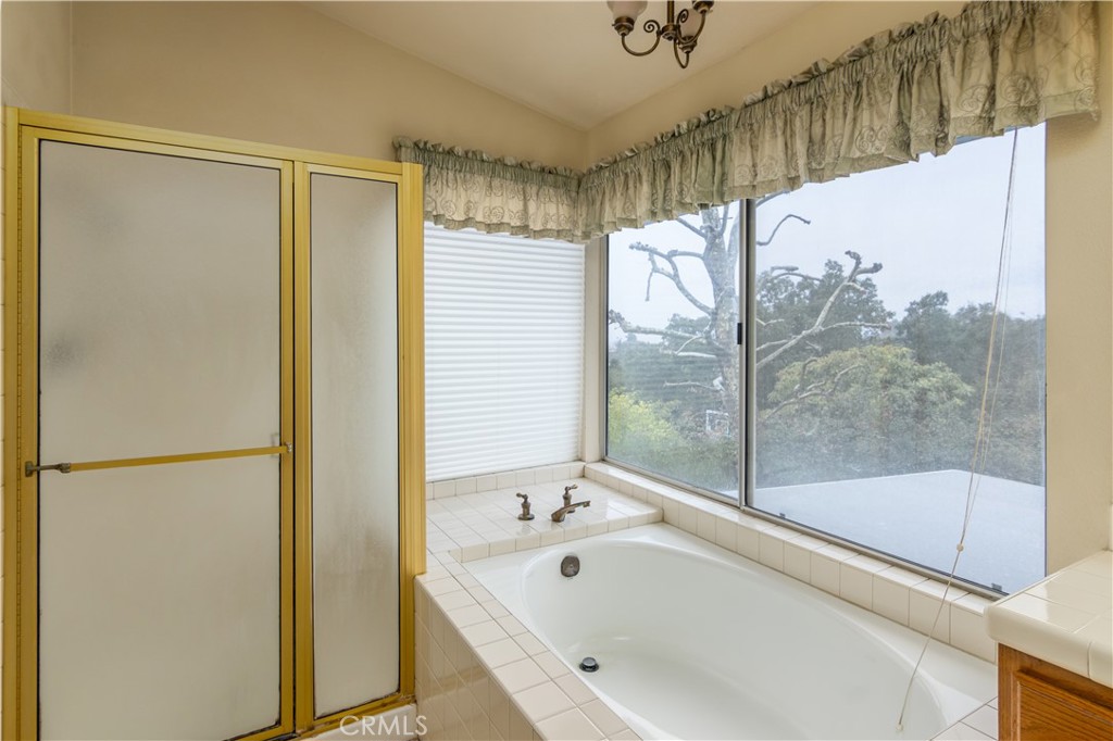 2887 Queens Way Thousand Oaks, CA 91362 - Photo 27 of 35 a bathroom with a bathtub and a shower