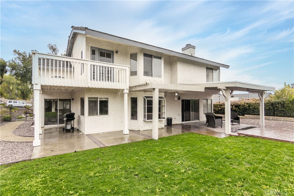 2887 Queens Way Thousand Oaks, CA 91362 - Photo 34 of 35 a front view of a house with garden and sitting area