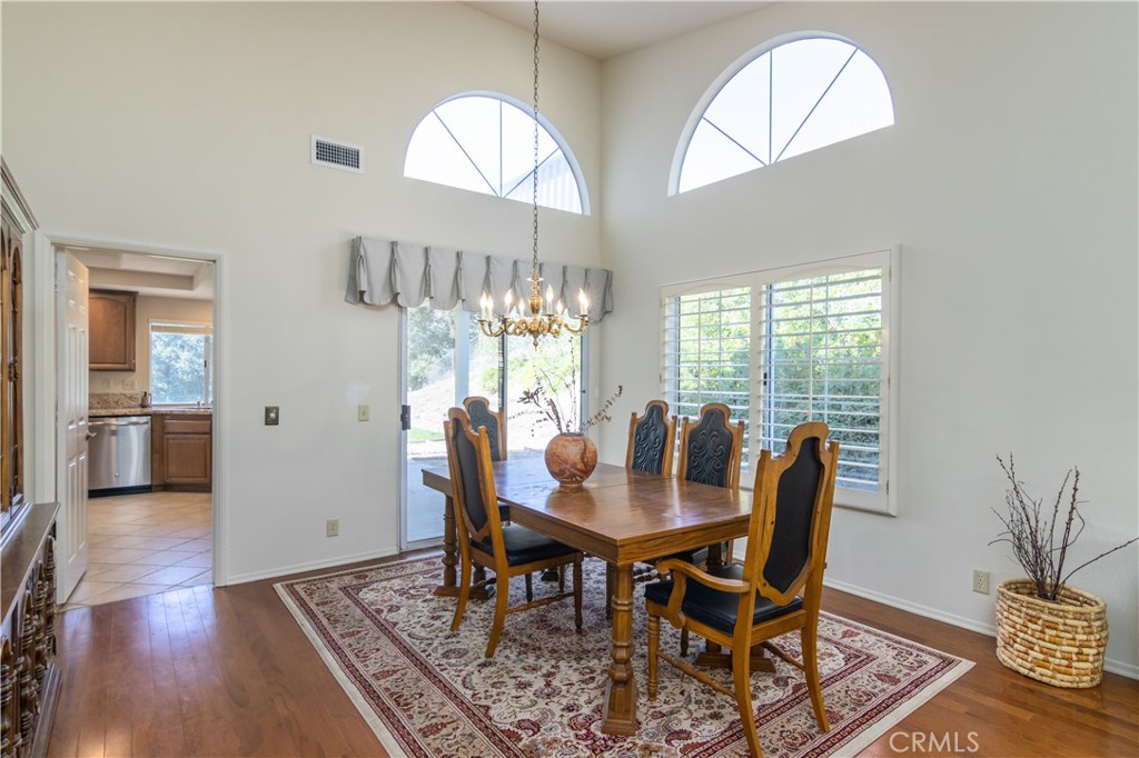 2887 Queens Way Thousand Oaks, CA 91362 - Photo 8 of 35 a view of a dining room with furniture and wooden floor