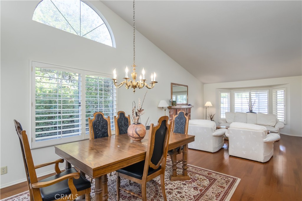 2887 Queens Way Thousand Oaks, CA 91362 - Photo 9 of 35 a view of a dining room with furniture a chandelier and wooden floor