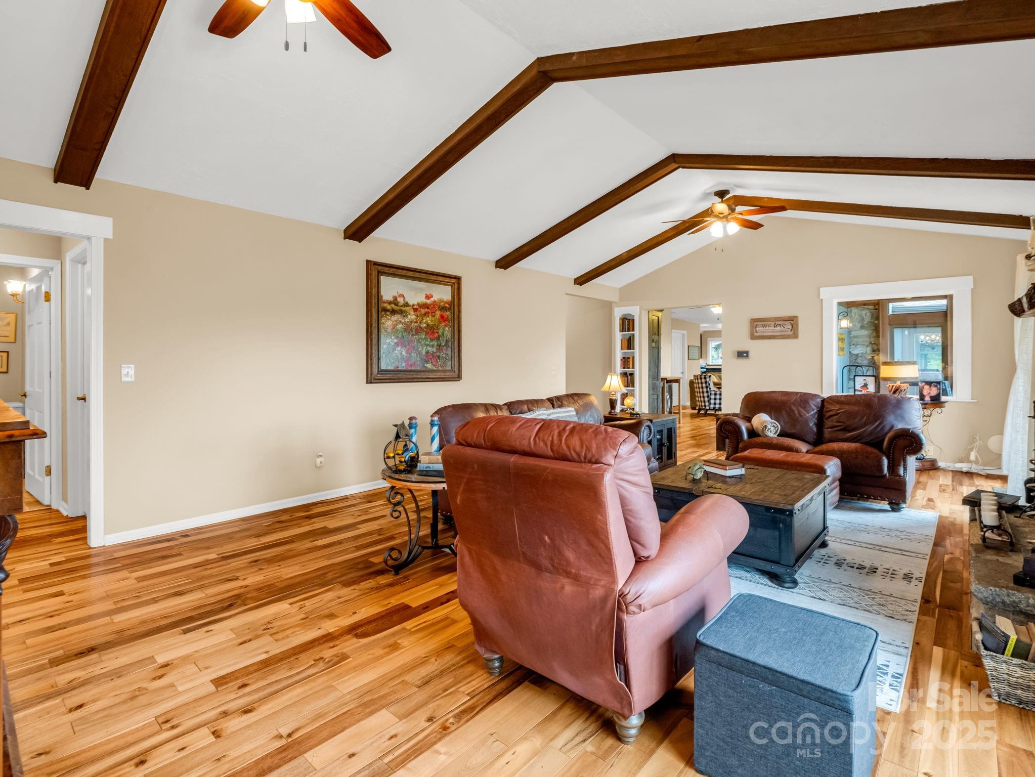 315 Thomas A Edison Rd Lake Lake Lure, NC 28746 - Photo 12 of 47 a living room with furniture and a mirror
