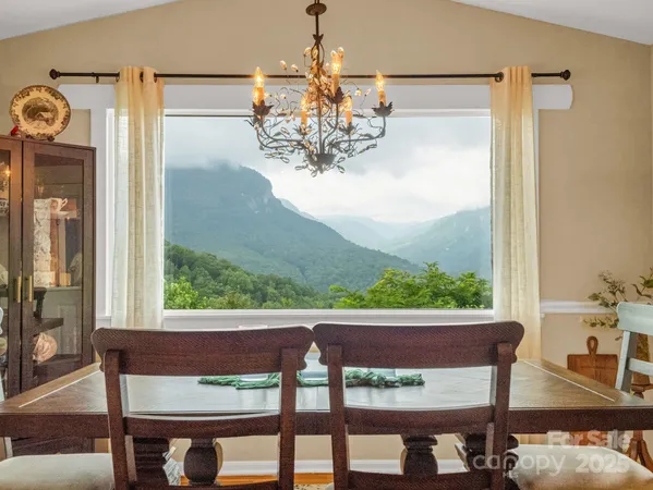 a view of a dining room with furniture window and outside view