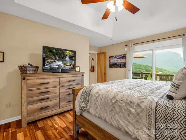 a bedroom with a bed and a dresser