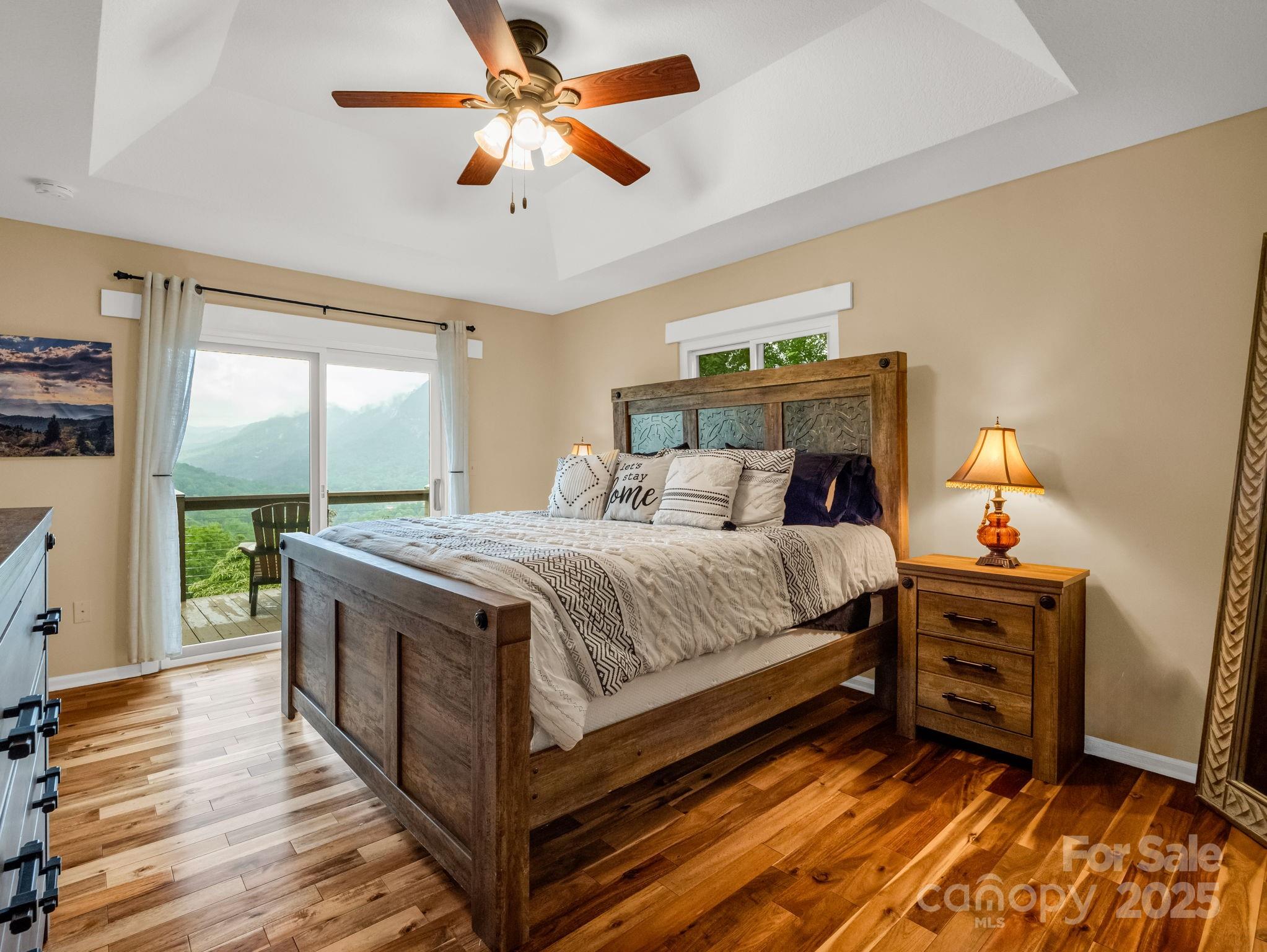 315 Thomas A Edison Rd Lake Lake Lure, NC 28746 - Photo 26 of 47 a bedroom with a bed and a large window