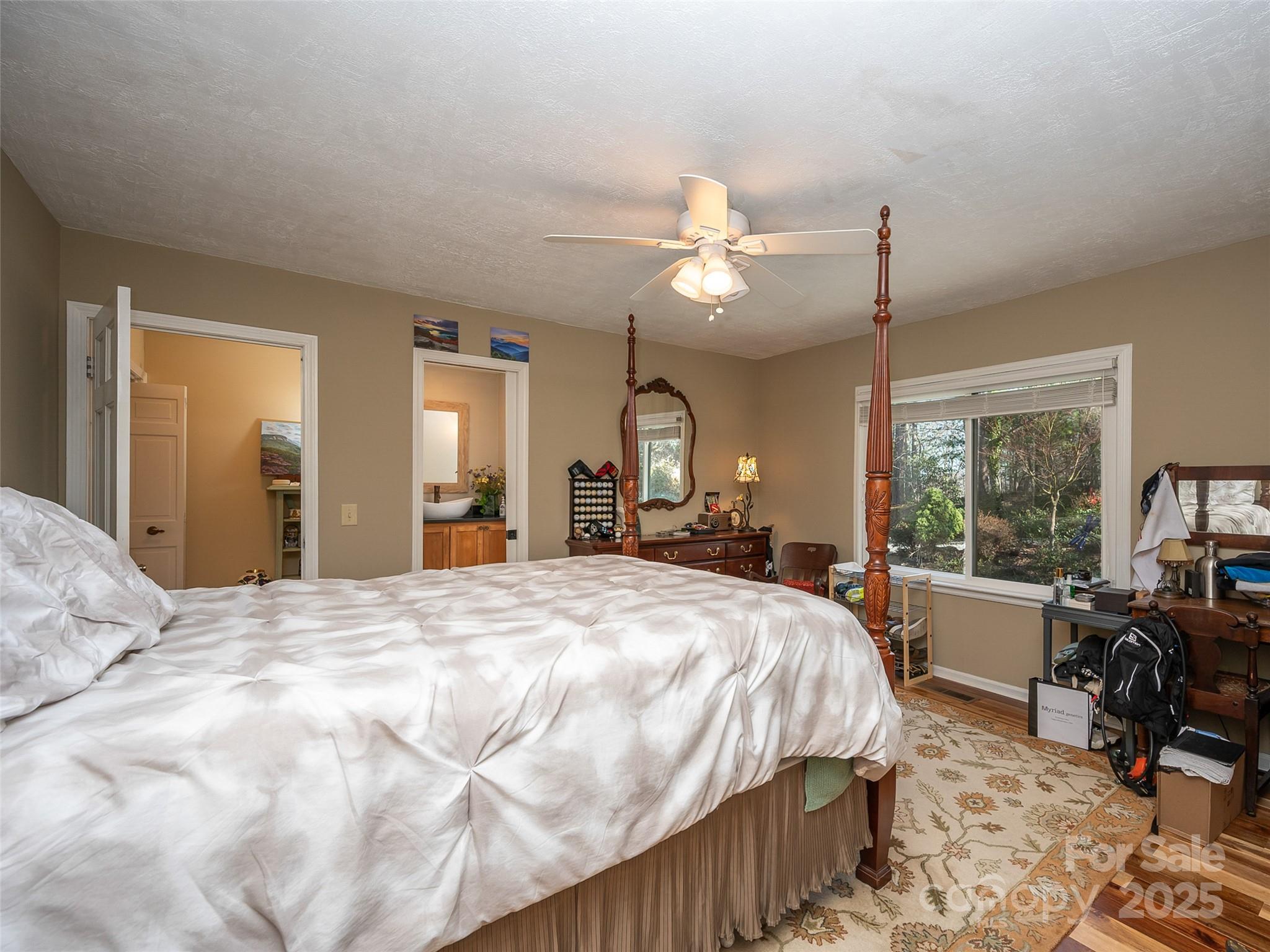 315 Thomas A Edison Rd Lake Lake Lure, NC 28746 - Photo 28 of 47 a spacious bedroom with a bed a table and chair
