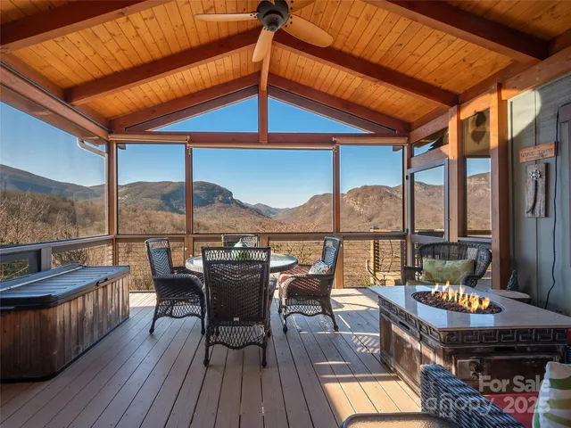 a balcony with furniture and wooden floor