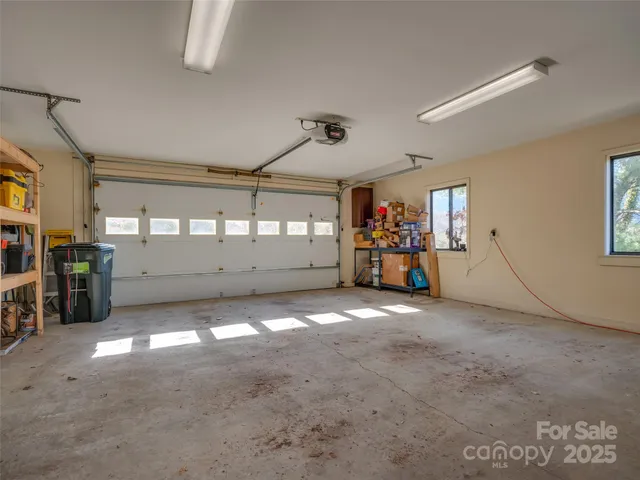 a view of a big room with closet and windows