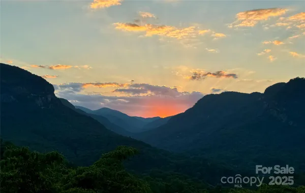 a view of an ocean and mountain