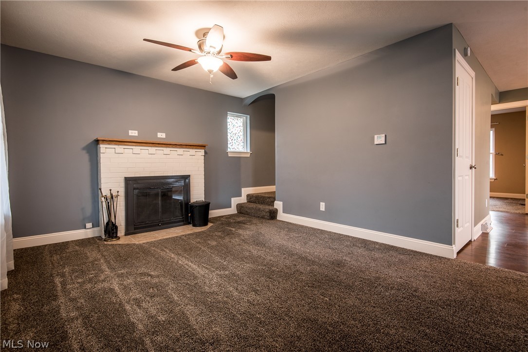 134 East Comet Road Clinton, OH 44216 - Photo 7 of 30 Living room with fireplace