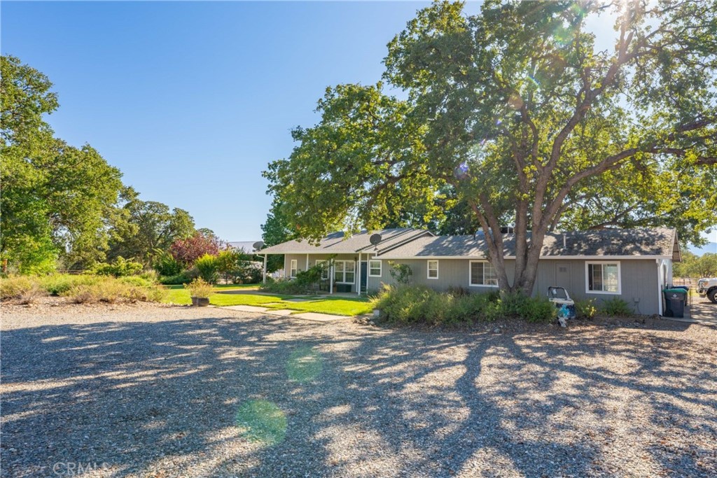 16495 Ridge Road Red Bluff, CA 96080 - Photo 1 of 1 a view of pool with umbrella and wooden fence