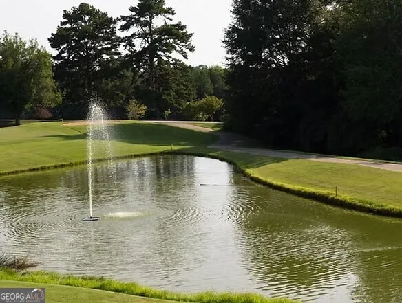 a view of a swimming pool with a lake view