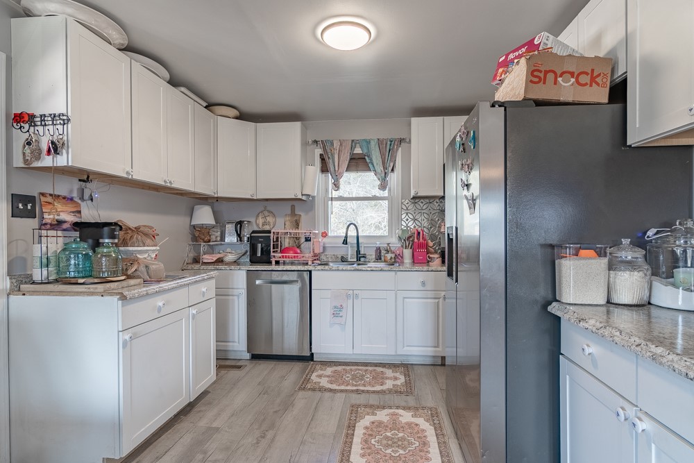 708 Sexton Gin Road Iva, SC 29655 - Photo 10 of 20 This bright kitchen features ample cabinetry and modern appliances, creating a functional and inviting space.