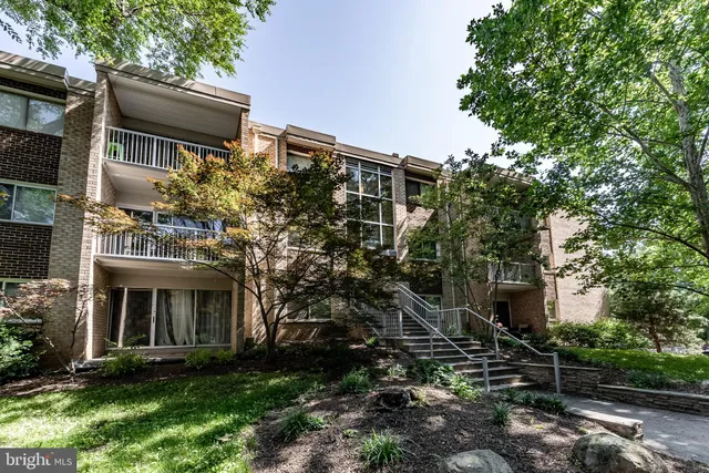 a view of a building with a yard