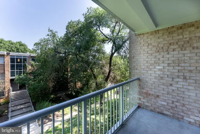 a view of a balcony with an outdoor space