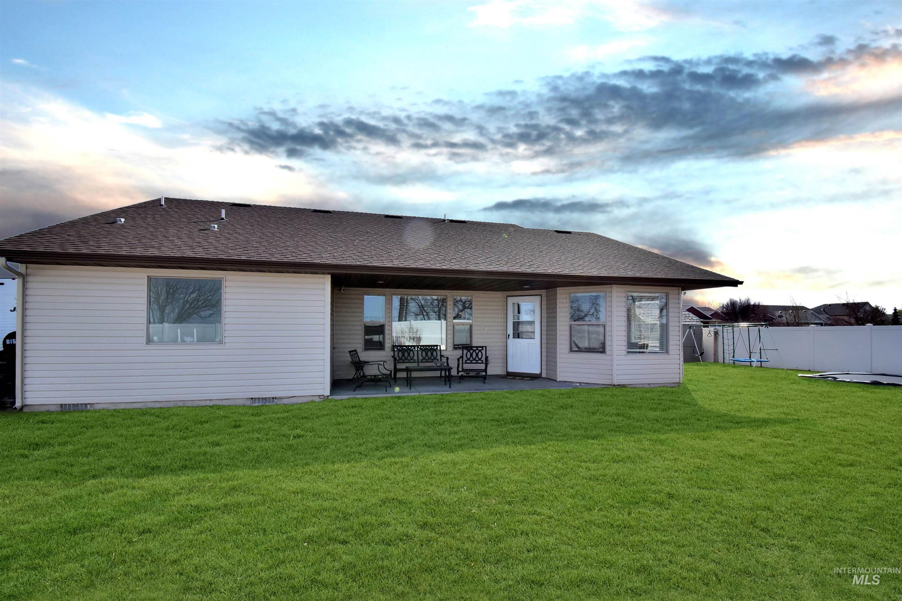2407 Forge Street Twin Falls, ID 83301 - Photo 20 of 20 Back of property featuring a shingled roof and a patio