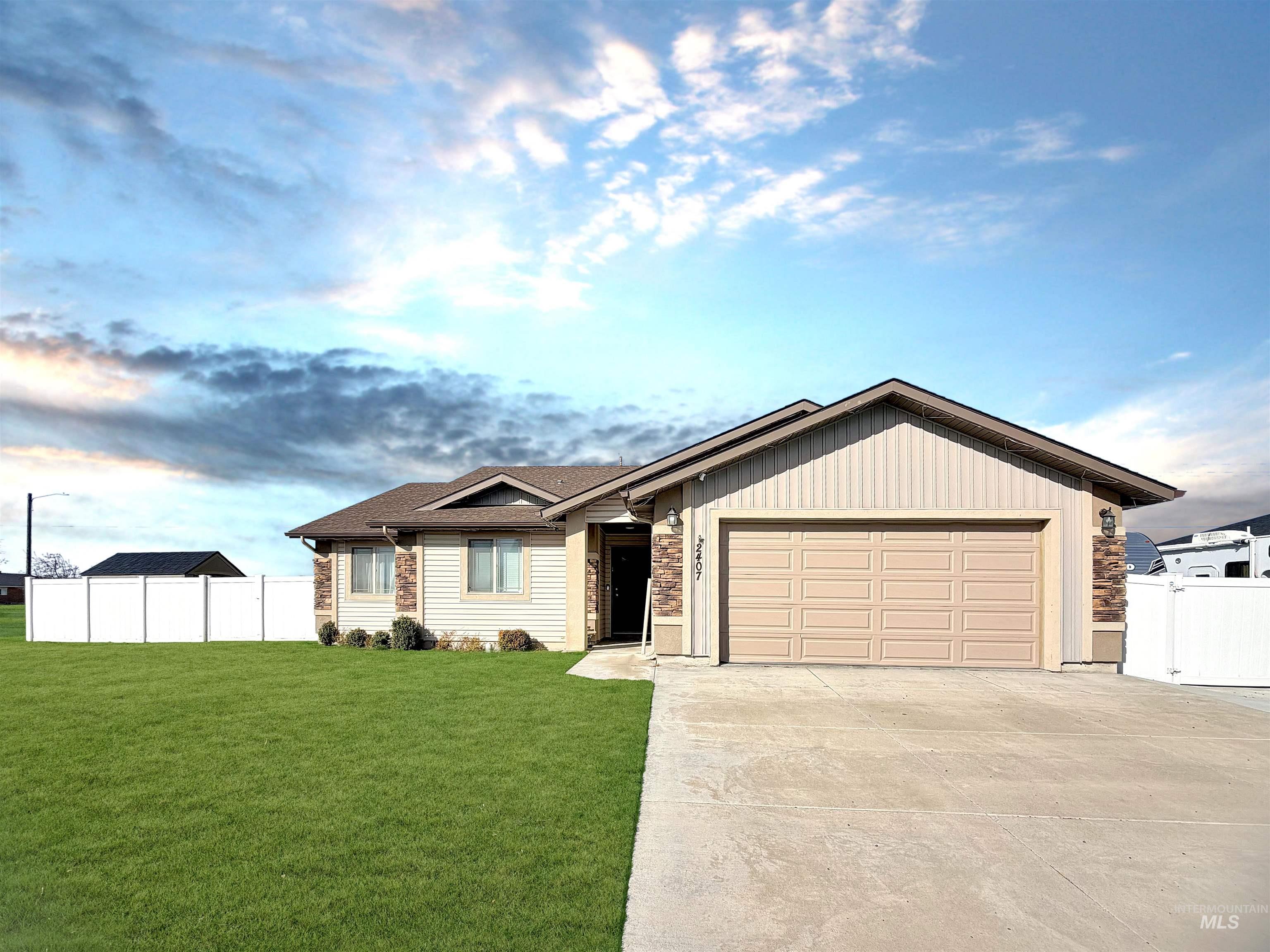 2407 Forge Street Twin Falls, ID 83301 - Photo 2 of 20 Ranch-style home featuring a garage, driveway, and roof with shingles