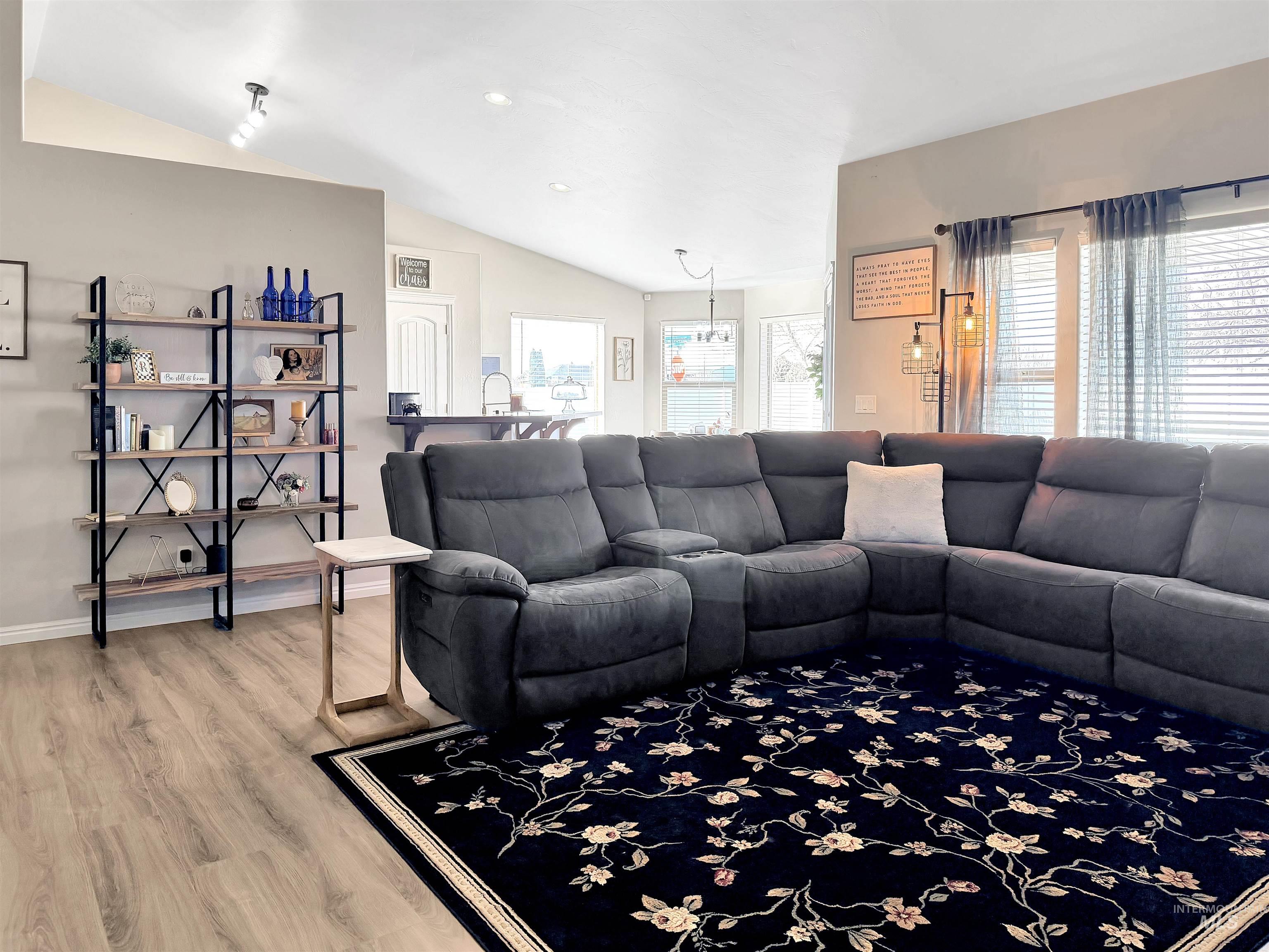 2407 Forge Street Twin Falls, ID 83301 - Photo 4 of 20 Living room with lofted ceiling, light wood-style floors, and recessed lighting