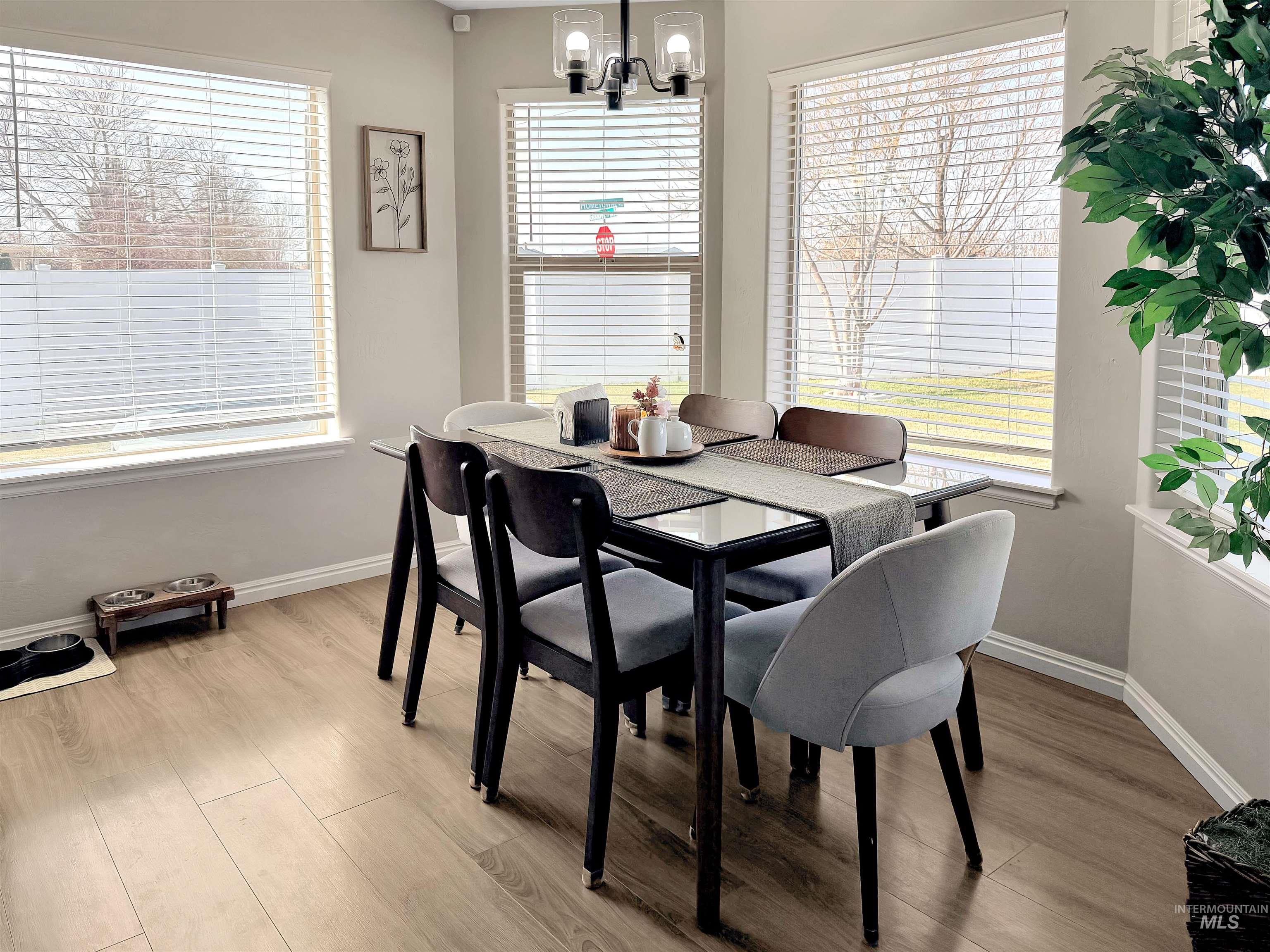 2407 Forge Street Twin Falls, ID 83301 - Photo 6 of 20 Dining room featuring light wood-style flooring and hanging lights