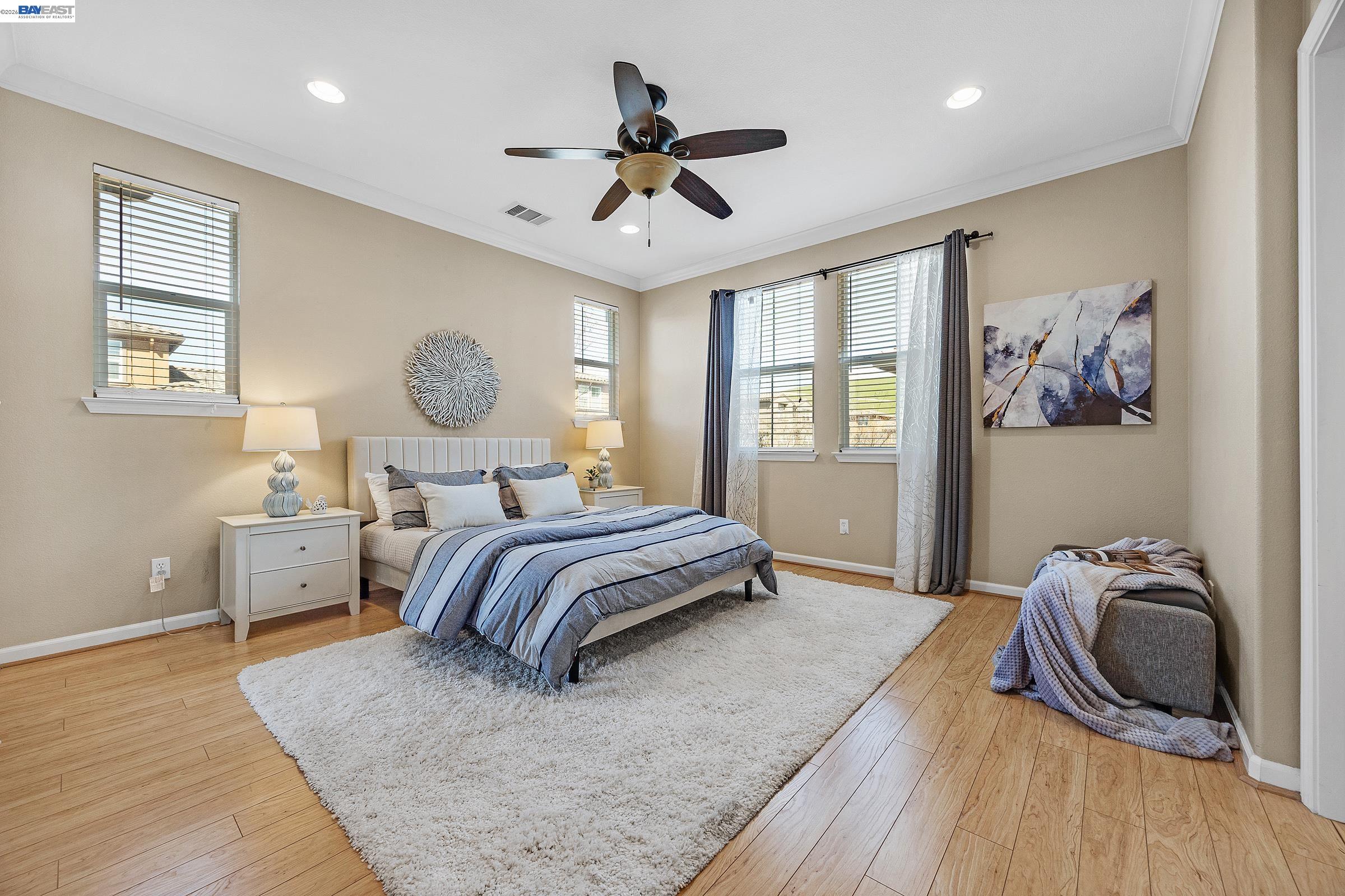 5216 Fioli Loop San Ramon, CA 94582 - Photo 13 of 41 a bedroom with a bed and wooden floor