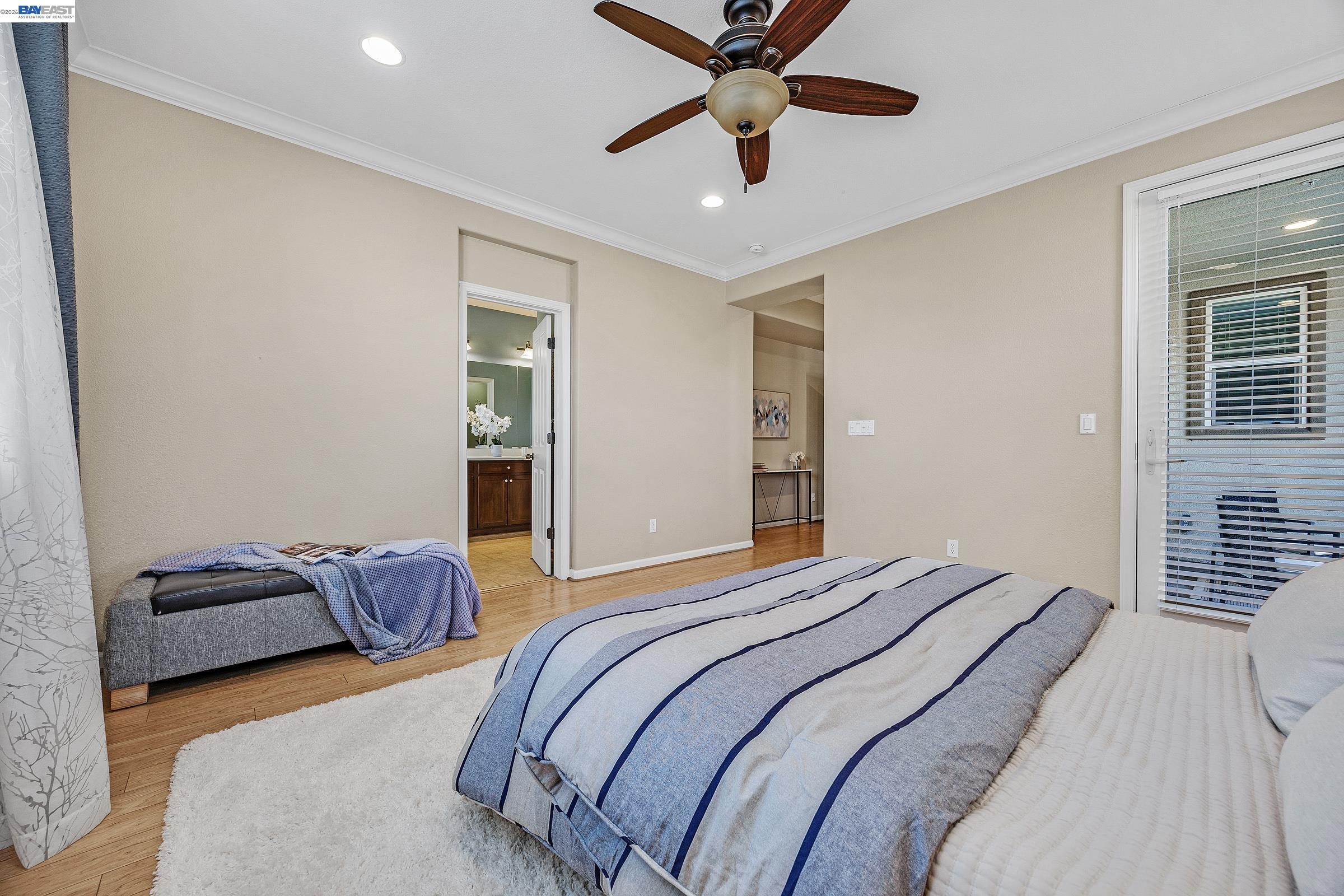5216 Fioli Loop San Ramon, CA 94582 - Photo 14 of 41 a bedroom with a bed and a ceiling fan