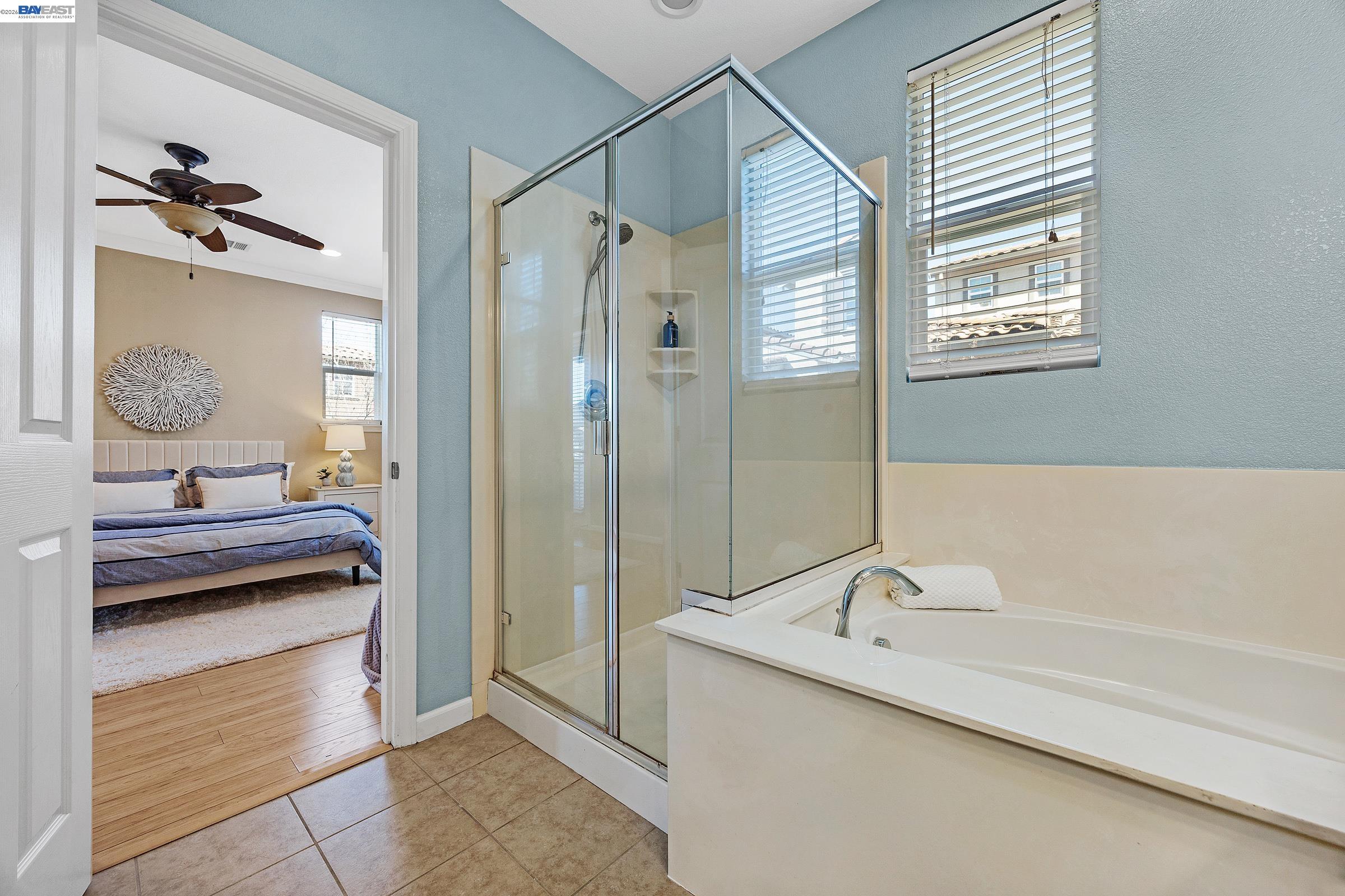 5216 Fioli Loop San Ramon, CA 94582 - Photo 16 of 41 a bathroom with a tub sink and mirror