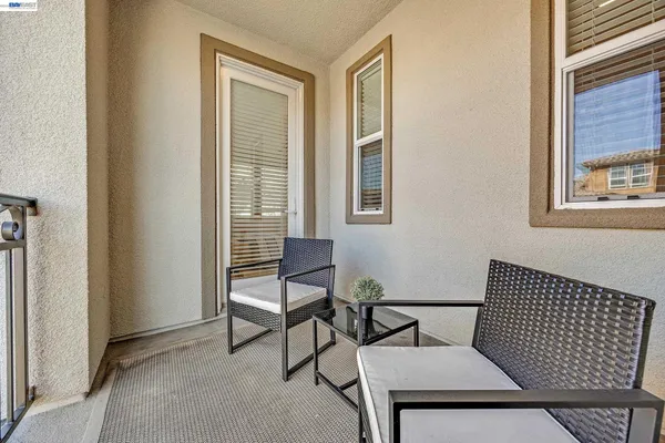 a view of a room that has a couch and a table in it