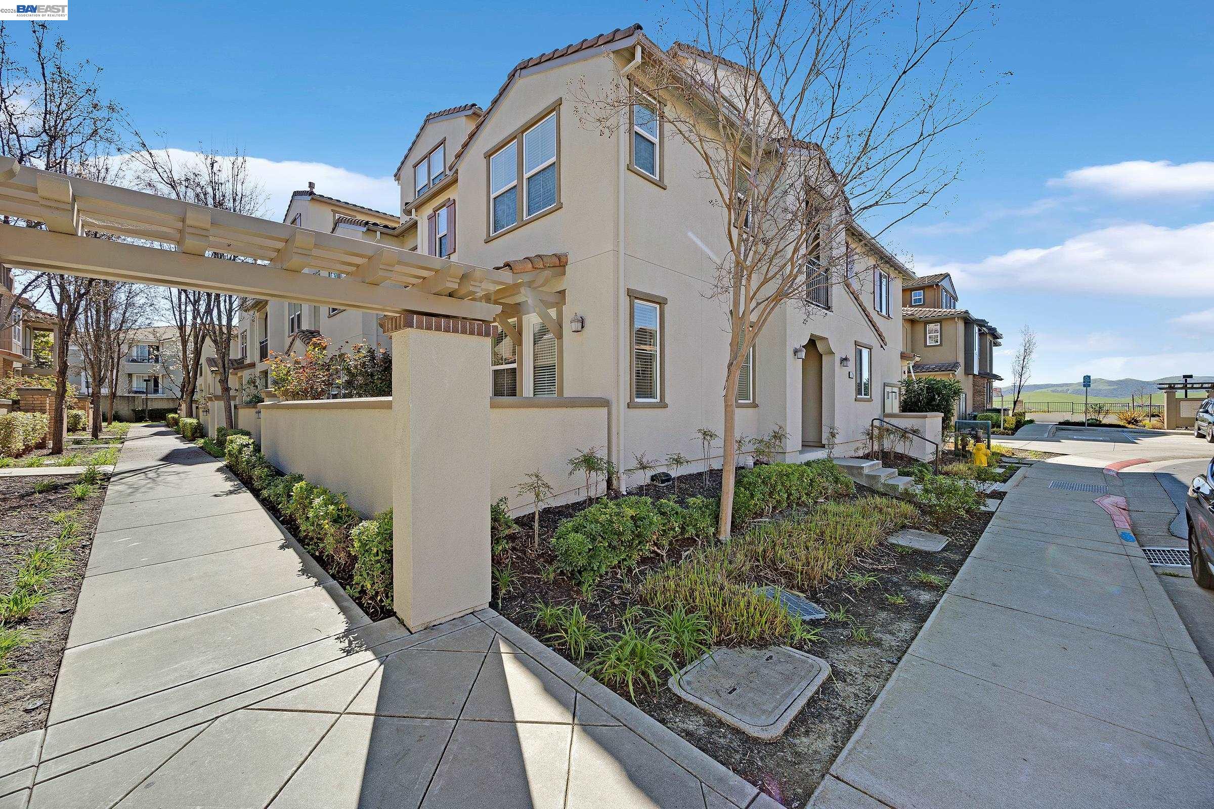 5216 Fioli Loop San Ramon, CA 94582 - Photo 2 of 41 a front view of a building with pathway