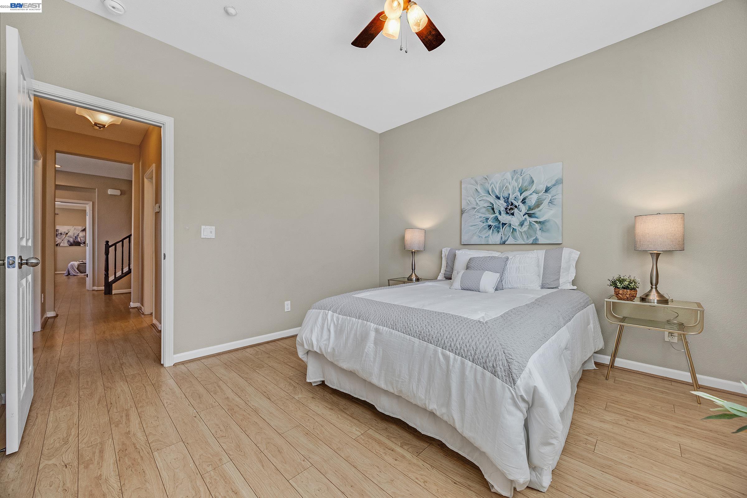 5216 Fioli Loop San Ramon, CA 94582 - Photo 25 of 41 a bedroom with a bed and wooden floor