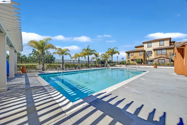 a view of swimming pool with outdoor seating