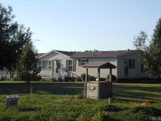 2746 Lucy Garrett Road Timberlake, NC 27583 - Photo 1 of 1 a front view of a house with a yard