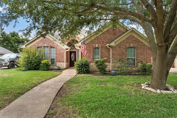 front view of a house with a yard