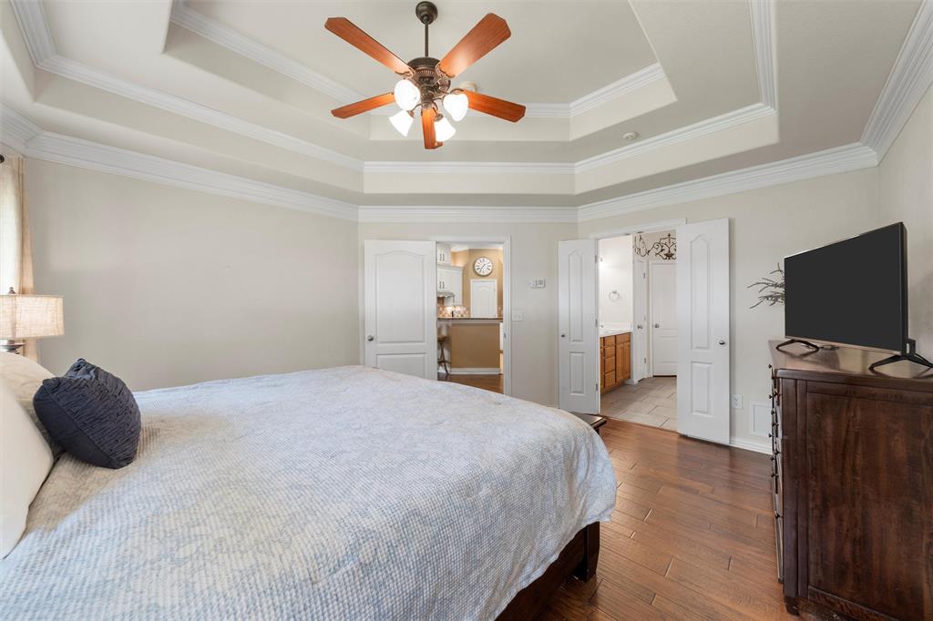 301 Canterbury Road Waco, TX 76712 - Photo 11 of 25 a bedroom with a bed and a flat screen tv