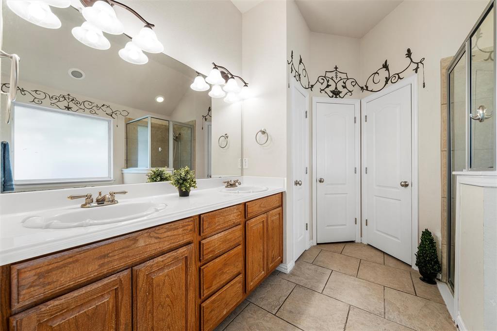 301 Canterbury Road Waco, TX 76712 - Photo 13 of 25 a spacious bathroom with a double vanity sink mirror and shower