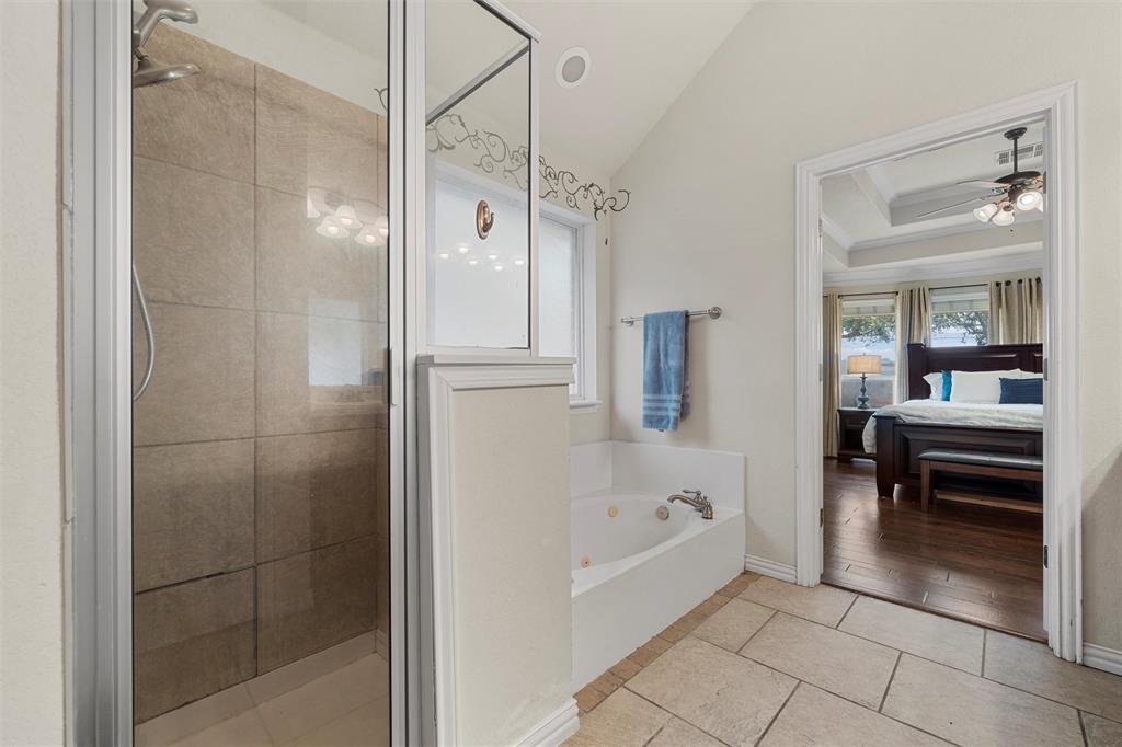 301 Canterbury Road Waco, TX 76712 - Photo 14 of 25 a bathroom with a bathtub and a shower