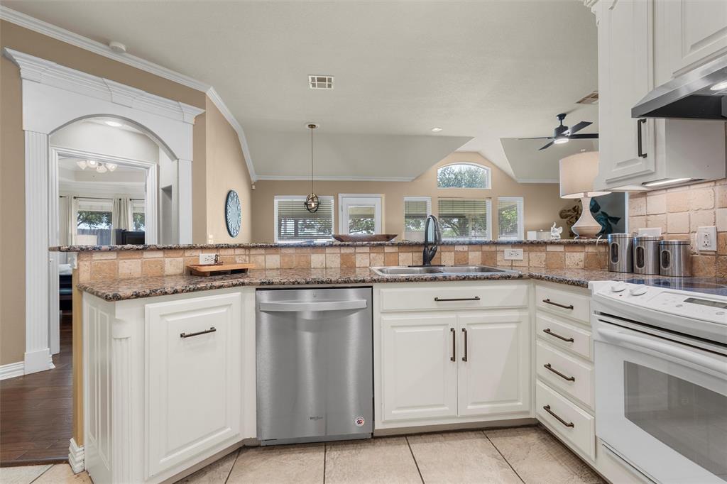 301 Canterbury Road Waco, TX 76712 - Photo 16 of 25 a kitchen with white cabinets and white appliances