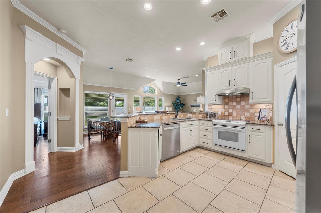 301 Canterbury Road Waco, TX 76712 - Photo 17 of 25 a kitchen with cabinets and wooden floor