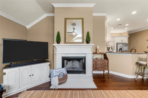 a living room with furniture fireplace and flat screen tv