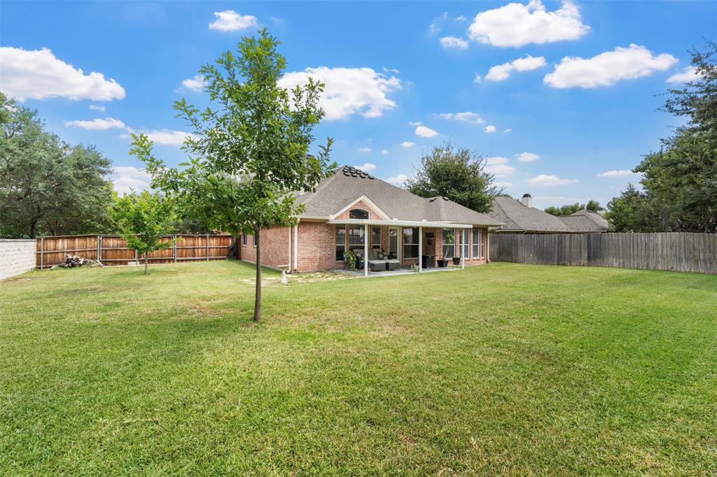 301 Canterbury Road Waco, TX 76712 - Photo 24 of 25 a house with green field in front of it