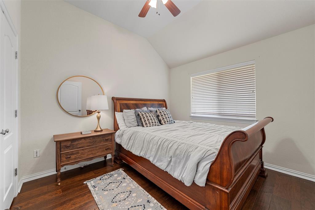 301 Canterbury Road Waco, TX 76712 - Photo 8 of 25 a bedroom with a bed a dresser and a potted plant