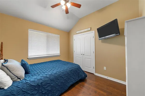 a bedroom with bed and window
