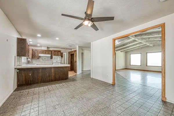 a kitchen with stainless steel appliances granite countertop a stove and a refrigerator
