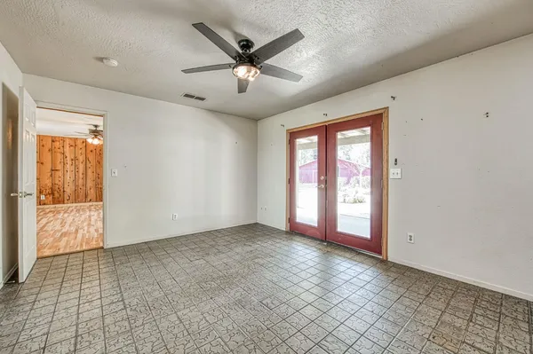 a kitchen with stainless steel appliances granite countertop a sink and cabinets with wooden floor