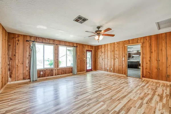 a view of a livingroom with a chandelier fan