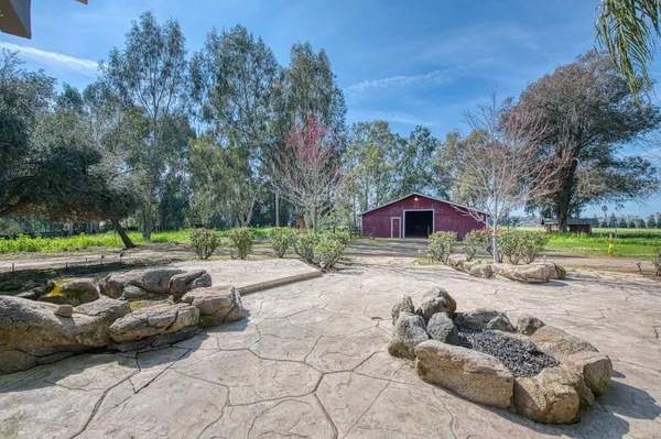 an aerial view of house with yard swimming pool and outdoor seating