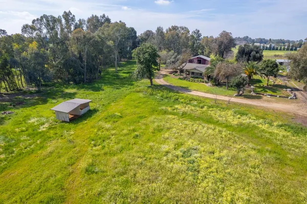 a view of a yard with swimming pool