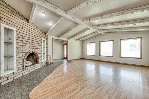 a view of a electric appliances and windows in a room