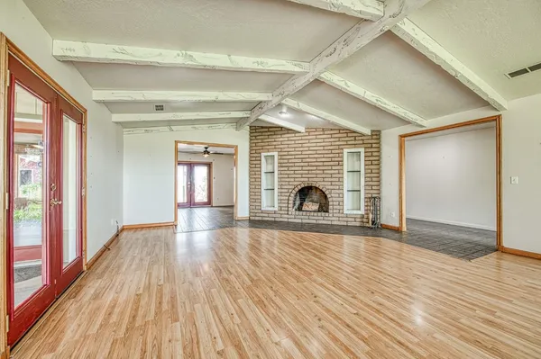 a view of a kitchen with a sink and cabinets